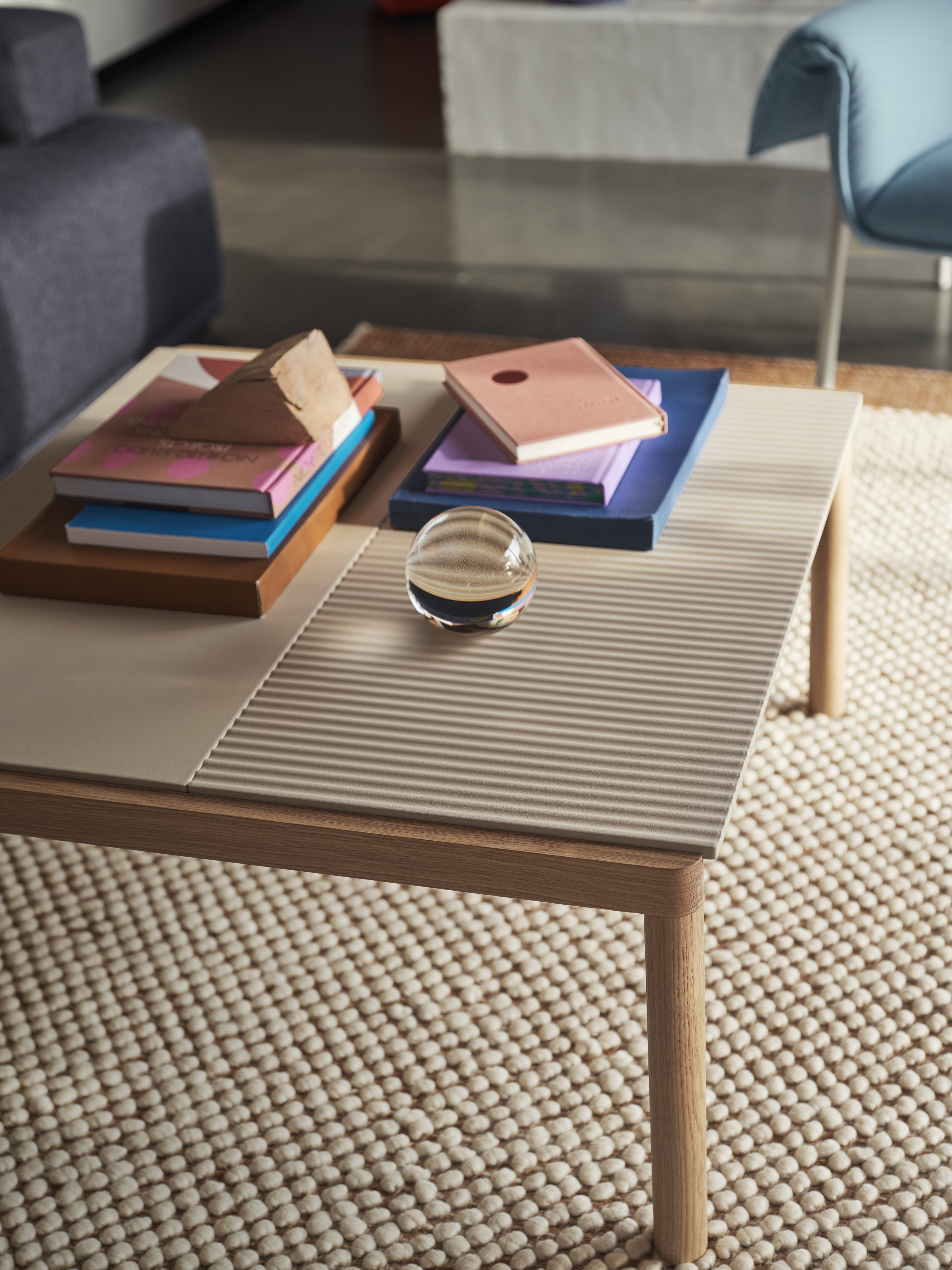 Couple Coffee Table 80x84x40 1 Plain 1 Wavy in Sand/Oak, Pebble Rug in Burnt Orange, Wrap Lounge Chair in Hero 732, Connect Soft Modular Sofa Ecriture 780