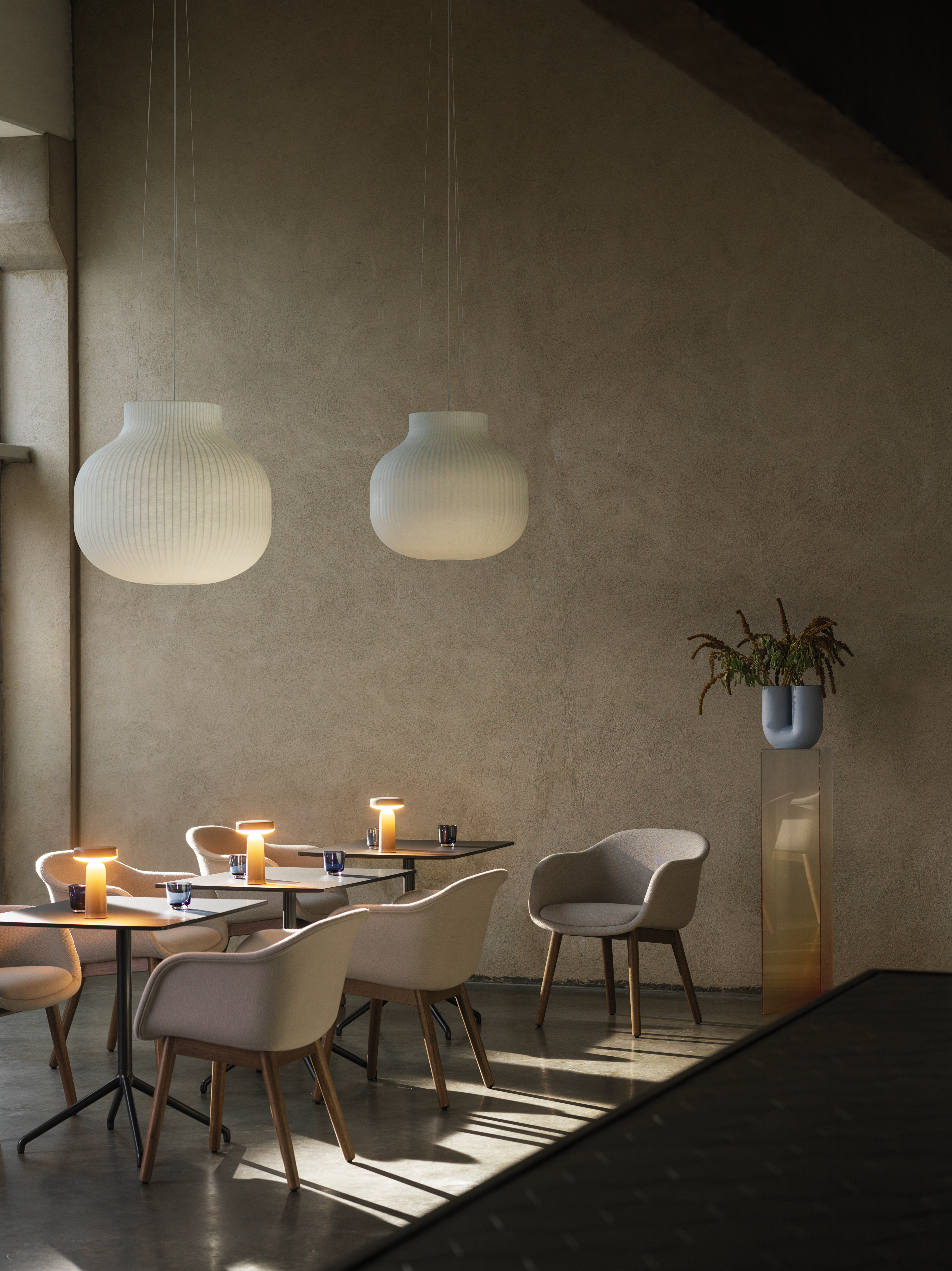 Fiber Conference in Hallingdal 113 & Stained Dark Brown - Still Café Table 75x65 in Black - Ease Portable Lamp in Taupe - Strand Closed Ø60 - Raise Glasses in Dark Blue - Kink Vase in Light Blue