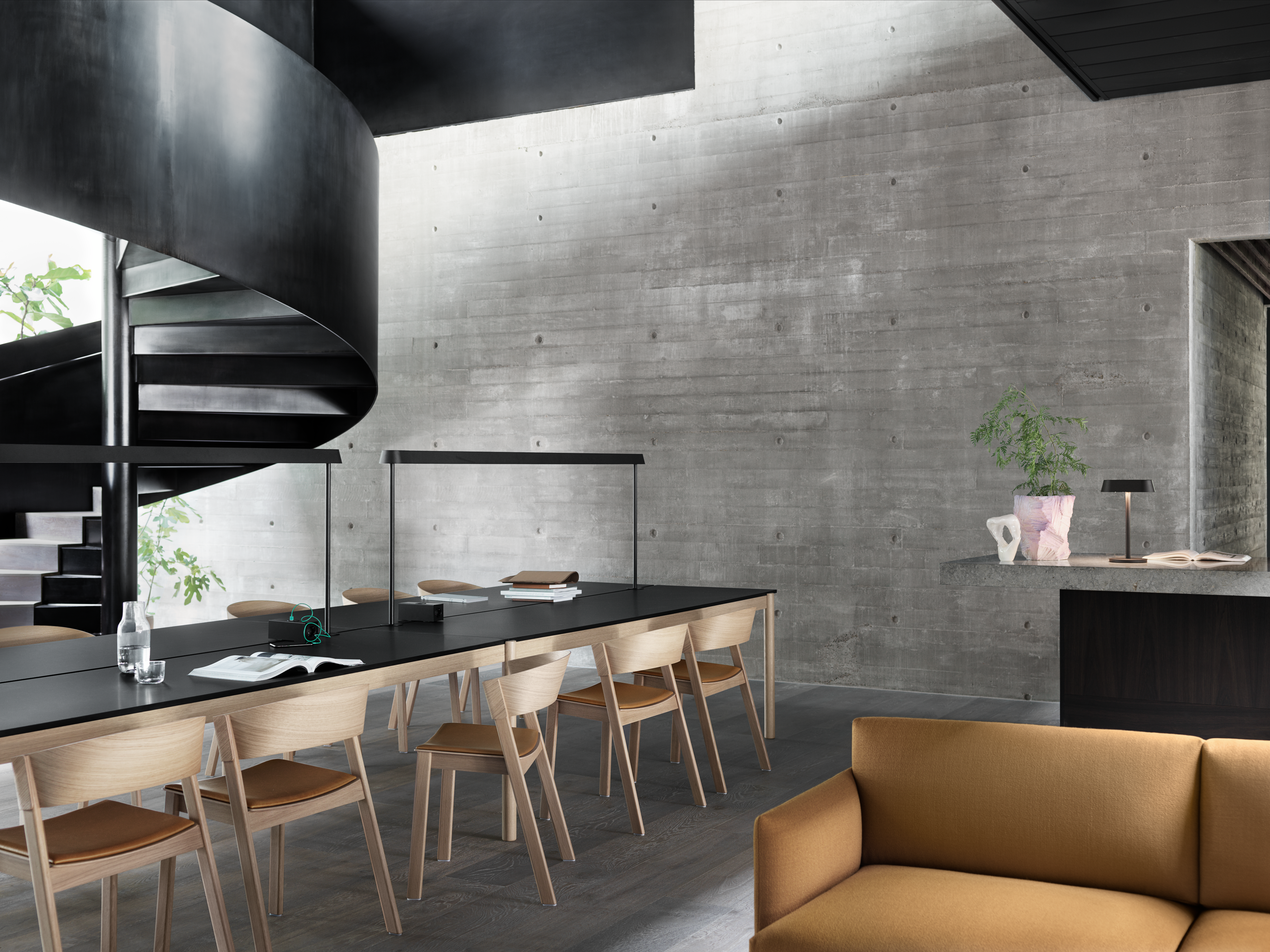 Linear System Table Configuration 2 w. Black Linoleum, Linear Mounted Lamp in Black, Linear Table Lamp in Black, Cover Side Chair in Oak/Cognac Refine Leather, Outline Studio Sofa in Vidar 472