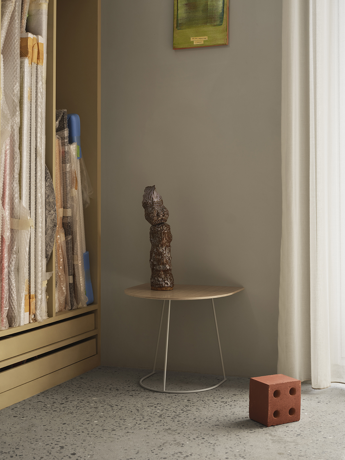 A compact, modern furniture piece with an airy oak veneer and off-white panels, featuring a clean, minimalist design.