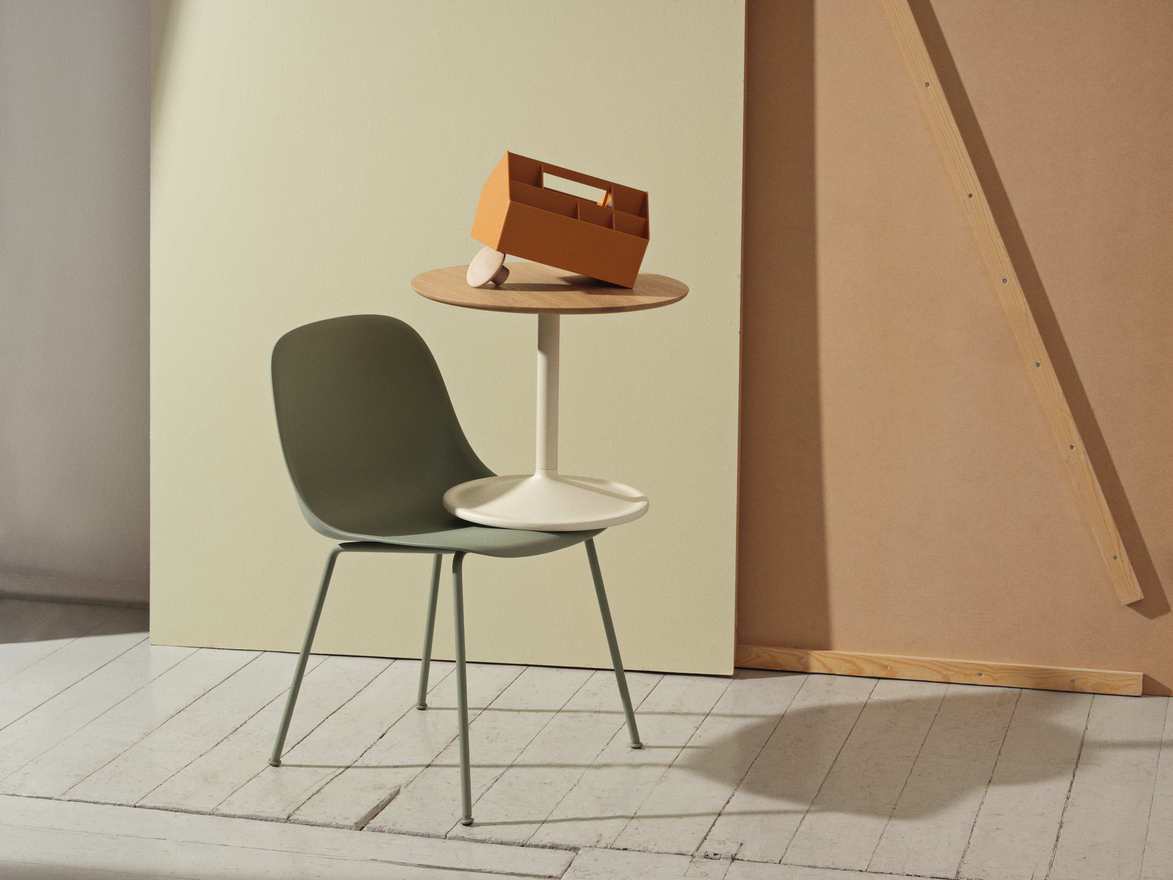 Minimal setting featuring the Fiber Side Chair, Soft Side Table, Sketch Toolbox, and Dots wall hooks.